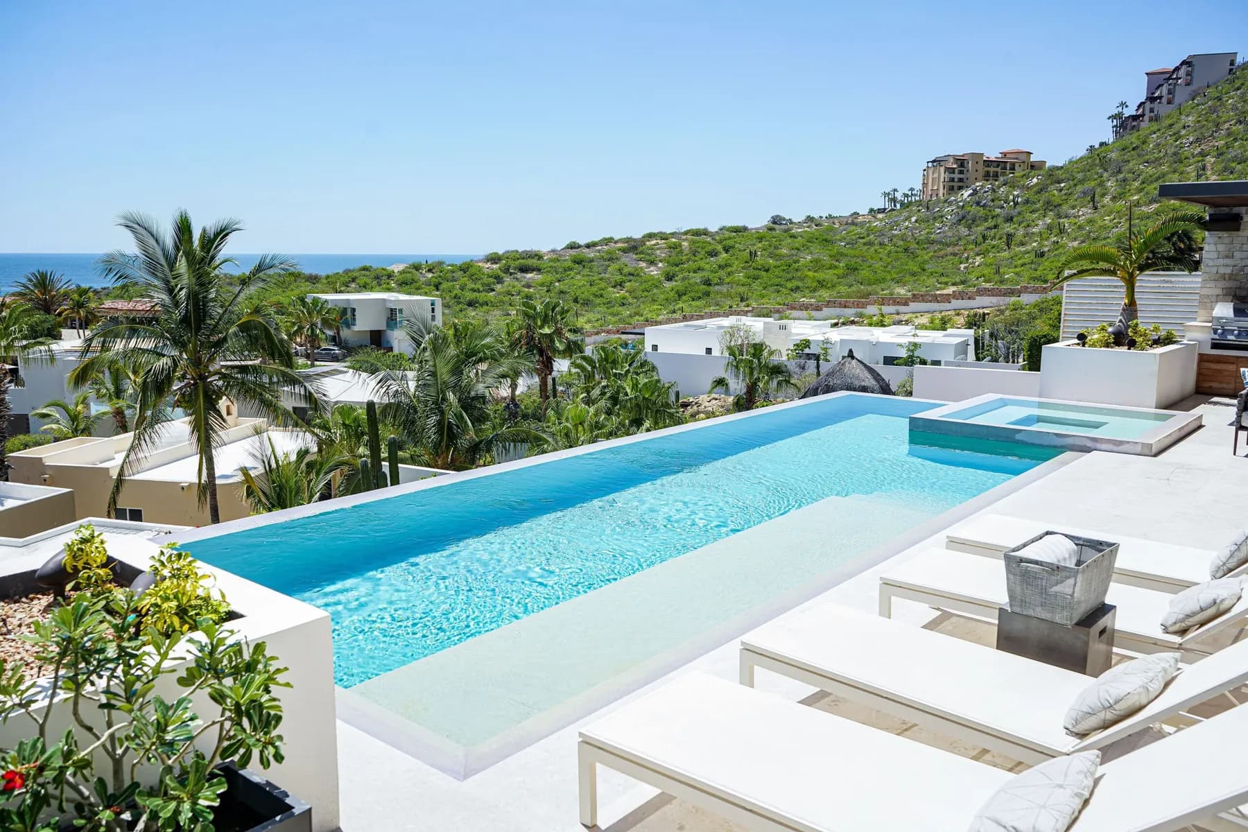 Casa Texas, Pedregal — infinity pool, patio, hillside villas and the ocean
